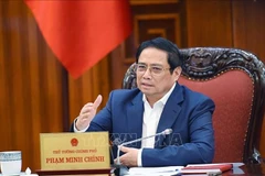 越南政府总理范明政：促进颁布有关债务重组和公司债券的两项通知