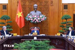 政府总理范明政主持召开政府落实第18号决议指导委员会第二次会议。图自越通社