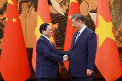  越南政府总理范明政会见中共中央总书记、中国国家主席习近平。图自越通社