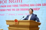 越南政府总理范明政发表讲话。图自越通社
