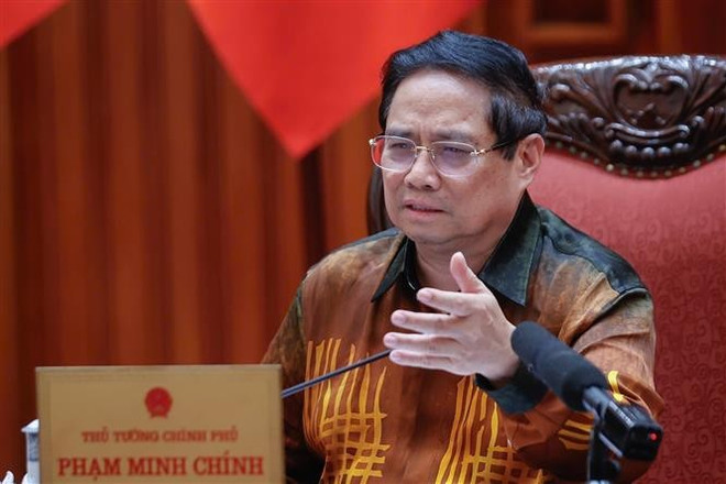 越南政府总理、越南区域与国际金融中心指导委员会主任范明政。图自越通社 vna-potal-thu-tuong-chu-tri-cuoc-hop-ve-trung-tam-tai-chinh-quoc-te-tai-viet-nam-8048273.jpg