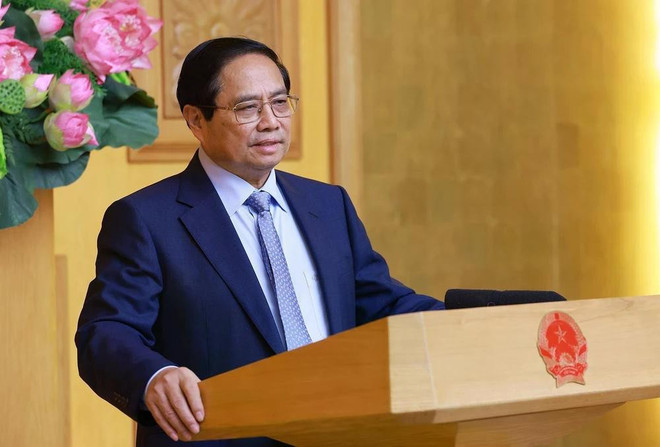 越南政府总理范明政要求确保涉企审批100%网上办理。图自越通社 vnapotalthutuongphamminhchinhgapmatdaidiendoanhnghiephoaky8029098-17479591966471261366172.jpg