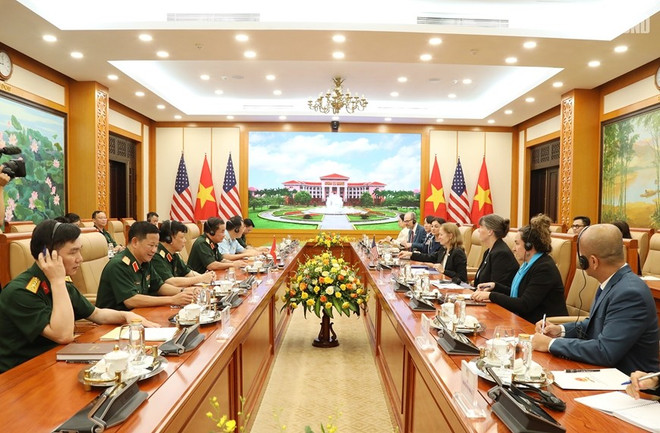 会议场景。图自越通社 quang-canh-buoi-tiep-photo-qdnd.jpg