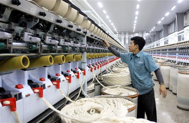 附图。图自越通社 san-xuat-cong-nghiep.jpg