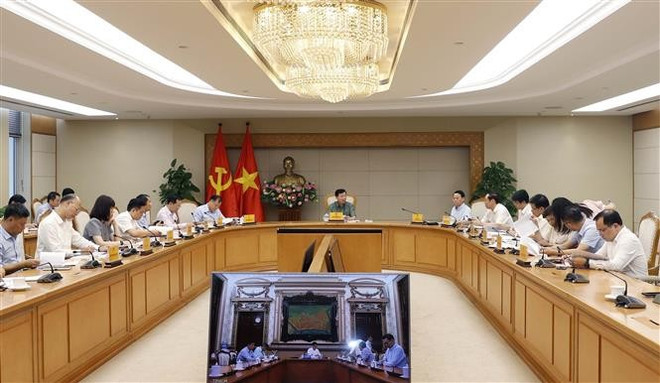 会议场景。图自越通社 vna-potal-tang-cuong-hieu-luc-hieu-qua-thuc-thi-chinh-sach-phap-luat-giai-quyet-tinh-trang-o-nhiem-moi-truong-8046197.jpg