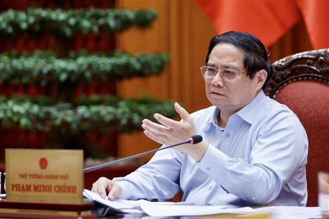 越南政府总理范明政主持会议。图自越通社 vna-potal-thuong-truc-chinh-phu-hop-ve-du-thao-nghi-quyet-phat-trien-kinh-te-tu-nhan-8018511.jpg