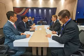 工作会谈现场。图自越通社