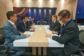 工作会谈现场。图自越通社