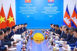 会见现场。图自越通社