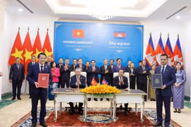 苏林总书记见证越柬合作文件签署和交换仪式。图自越通社