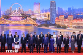 与会代表合影。图自越通社