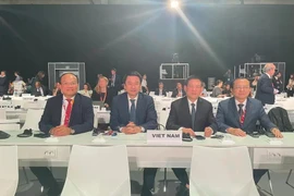 胡德福出席第四届国际发展融资会议会见国际组织和各国官员。图自越通社