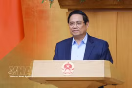 政府总理范明政在会上发表讲话。图自越通社