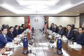 会谈现场。图自越通社
