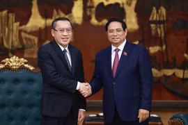 越南政府总理范明政会见老挝劳动与社会福利部部长坡赛·赛雅颂。图自越通社
