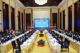 越老政府间委员会第48次会议现场。图自越通社