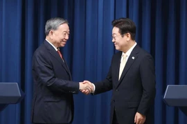 越共中央总书记苏林与韩国总统李在明。图自越通社