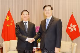 越南政府副总理胡德福和中国香港特别行政区长官李家超。图自越通社