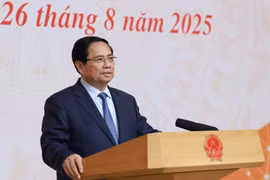 越南政府总理范明政发表讲话。图自越通社