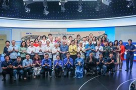 与会代表合影。图自越通社