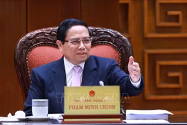 越南政府总理范明政主持召开政府组织机构调整指导委员会第十次会议。图自越通社