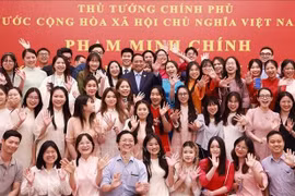 越南政府总理范明政会见旅居中国越南人社群代表。图自越通社
