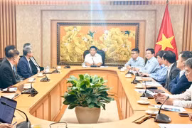 工作会谈场景。图自越通社