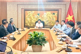 工作会谈场景。图自越通社