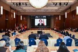 对话现场。图自越通社