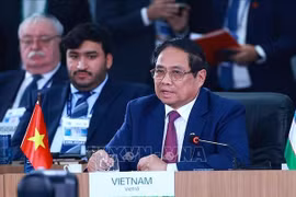 范明政在题为“加强多边主义、经济金融问题及人工智能”的高级别讨论会上发表重要讲话。图自越通社