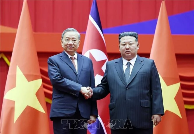 越共中央总书记苏林和朝鲜劳动党总书记、国务委员会委员长金正恩。图自越通社