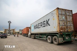 西宁省木牌国际口岸的货物进出口活动。图自越通社