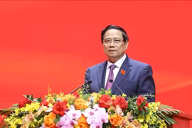 政府总理范明政。图自越通社