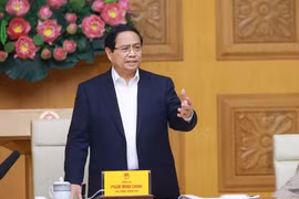 政府总理范明政在会上发言。图自越通社