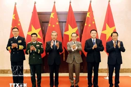 越中外交、国防、公安“3+3”战略对话机制首次部长级会议上的两国外交部长、国防部长和公安部长。图自越通社