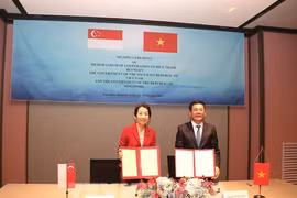 越南与新加坡《大米贸易合作备忘录》（MOC）签字仪式。图自越通社