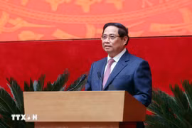 越南政府总理范明政发表讲话。图自越通社