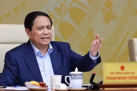 范明政主持召开2025年经济增长情景全国视频会议。图自越通社