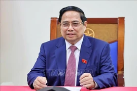 范明政总理与俄罗斯国家原子能集团公司总经理通电话。图自越通社