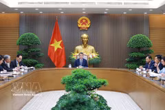 越南政府总理黎明兴与新西兰总理克里斯托弗·拉克森通电话。图自越通社