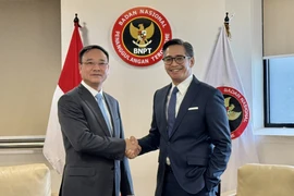 越南公安部副部长范世松中将与印尼国家反恐局副局长安迪卡·克里斯纳尤丹托（Andhika Chrisnayudhanto）。图自越通社
