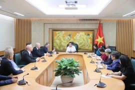 越南政府副总理阮志勇会见德越友好协会代表团。图自越通社