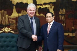 越南政府总理范明政会见荷兰阿斯麦（ASML）集团副总裁爱德华·斯蒂普豪特。图自越通社