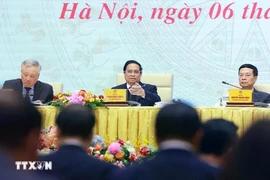 越南政府总理范明政主持国家数字化国家委员会和06号提案总结会议。图自越通社