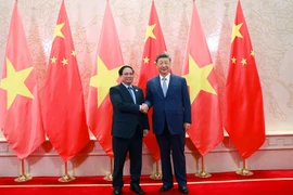 越南政府总理范明政会见中共中央总书记、国家主席习近平