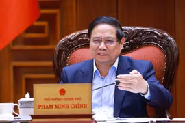 越南政府总理范明政发表讲话。图自越通社