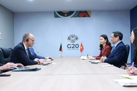 越南政府总理范明政会见德国总理弗里德里希·默茨。图自越通社