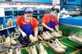 福安鞋业公司鞋类生产链。图自越通社