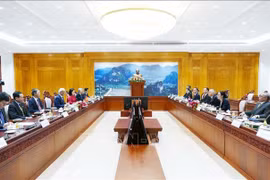 越南和平委员会与老挝和平与团结委员会举行会谈。图自越通社