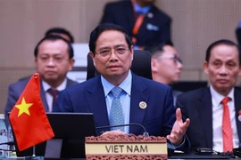 越南政府总理范明政出席会议。图自越通社